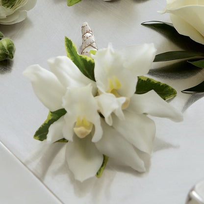 White Mini Cymbidium Boutonniere –  Homestead Flower Company Inc, Homestead FL